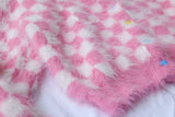 Cardigan en tricot de vison rose à simple boutonnage et nombril à carreaux