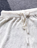 Conjunto de dos piezas de chaleco sin espalda con pantalones cortos con cordones ahuecados de tejer