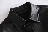 Manteau ceinturé en cuir à boutonnage simple avec col à revers