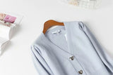 Cardigan en tricot à boutonnage simple et bouton en forme de cœur à col en V