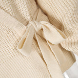 Suéteres de manga farol de albaricoque de punto con cordones y cuello en V