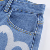 Pantalon en jean imprimé en forme de cœur en denim avec poche à simple boutonnage