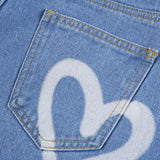 Pantalon en jean imprimé en forme de cœur en denim avec poche à simple boutonnage