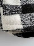 Abrigo tipo cárdigan estilo camisa de botonadura sencilla en blanco y negro 