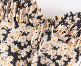 Mini-robe bustier tubulaire en mousseline à imprimé marguerites à lacets